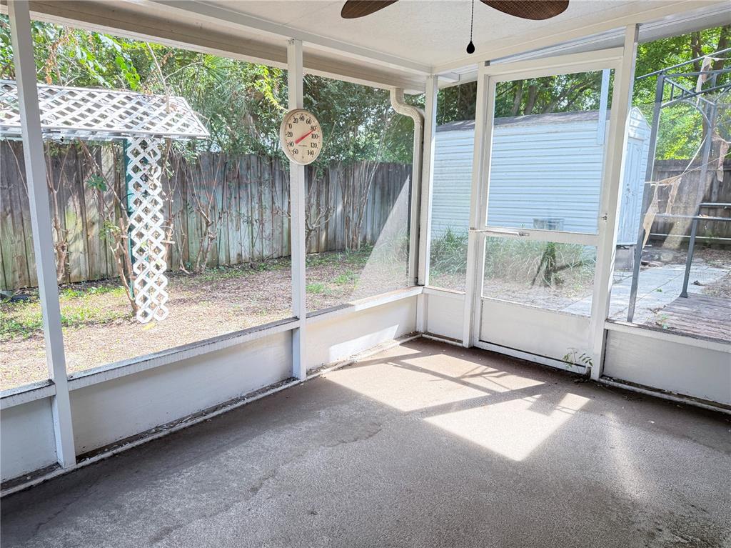 4262 Northeast 35th Avenue Road Ocala, FL 34479 - Photo 23 of 28 a view of a porch with furniture and garden