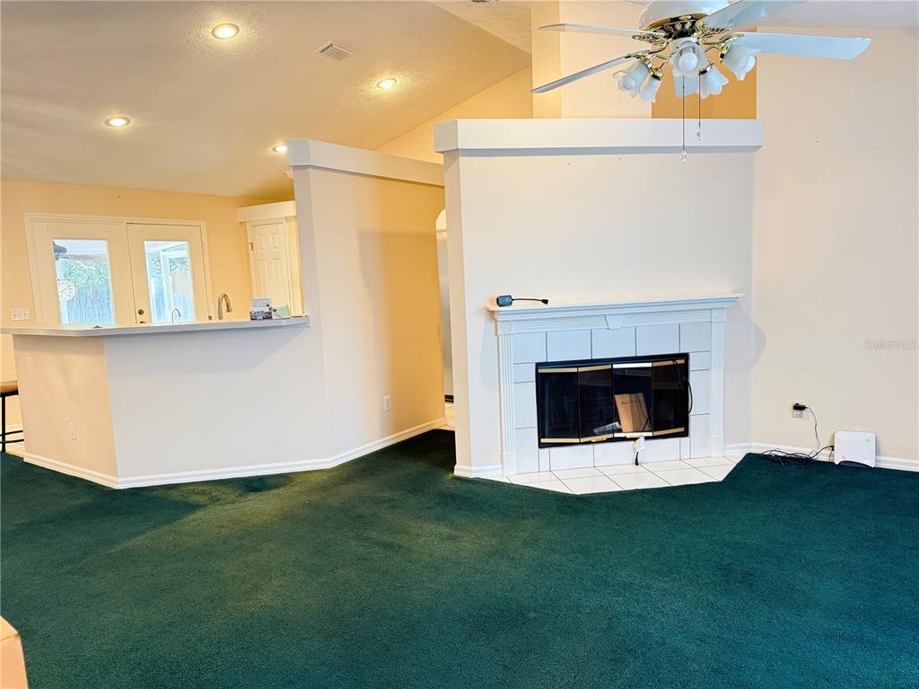 4262 Northeast 35th Avenue Road Ocala, FL 34479 - Photo 3 of 28 a room with a fireplace and a fireplace