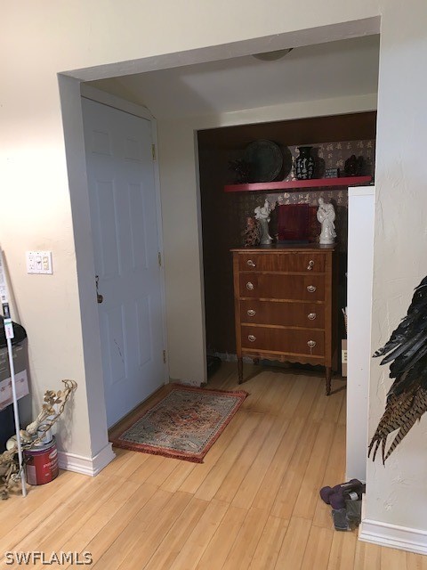 2307 Unity Avenue Fort Myers, FL 33901 - Photo 12 of 25 a room with a mirror and a dresser