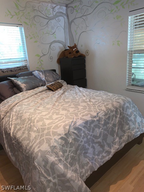 2307 Unity Avenue Fort Myers, FL 33901 - Photo 17 of 25 a bedroom with a bed and a window