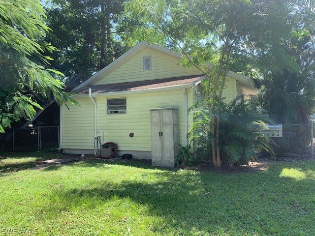 2307 Unity Avenue Fort Myers, FL 33901 - Photo 22 of 25 a front view of a house with a yard