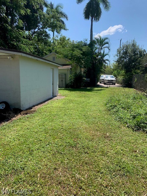 2307 Unity Avenue Fort Myers, FL 33901 - Photo 24 of 25 a backyard of a house with a garden and plants