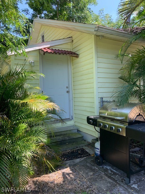 2307 Unity Avenue Fort Myers, FL 33901 - Photo 25 of 25 a backyard of a house with a yard and outdoor seating