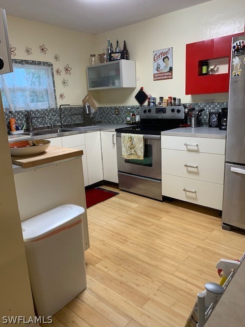 2307 Unity Avenue Fort Myers, FL 33901 - Photo 3 of 25 a living room with stainless steel appliances kitchen island granite countertop a stove and a wooden floor