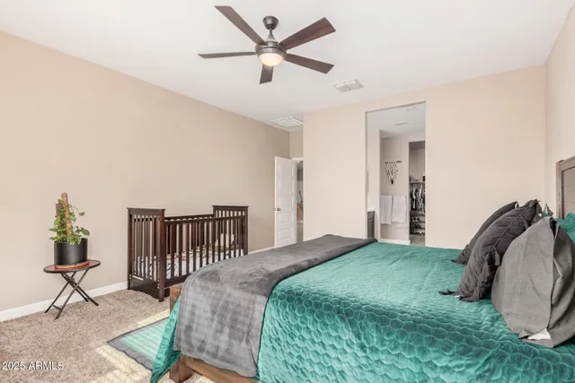 a bedroom with a bed dresser and a window