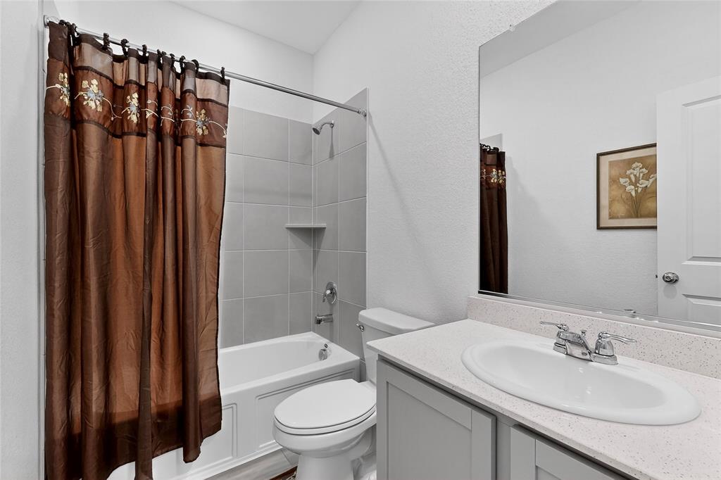 444 Ranchito Pass Fort Worth, TX 76052 - Photo 21 of 24 a bathroom with a sink toilet and shower