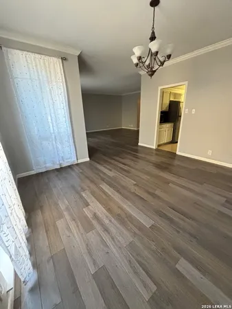 a view of hallway with wooden floor