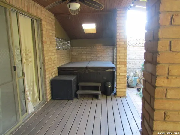 a view of balcony with wooden floor