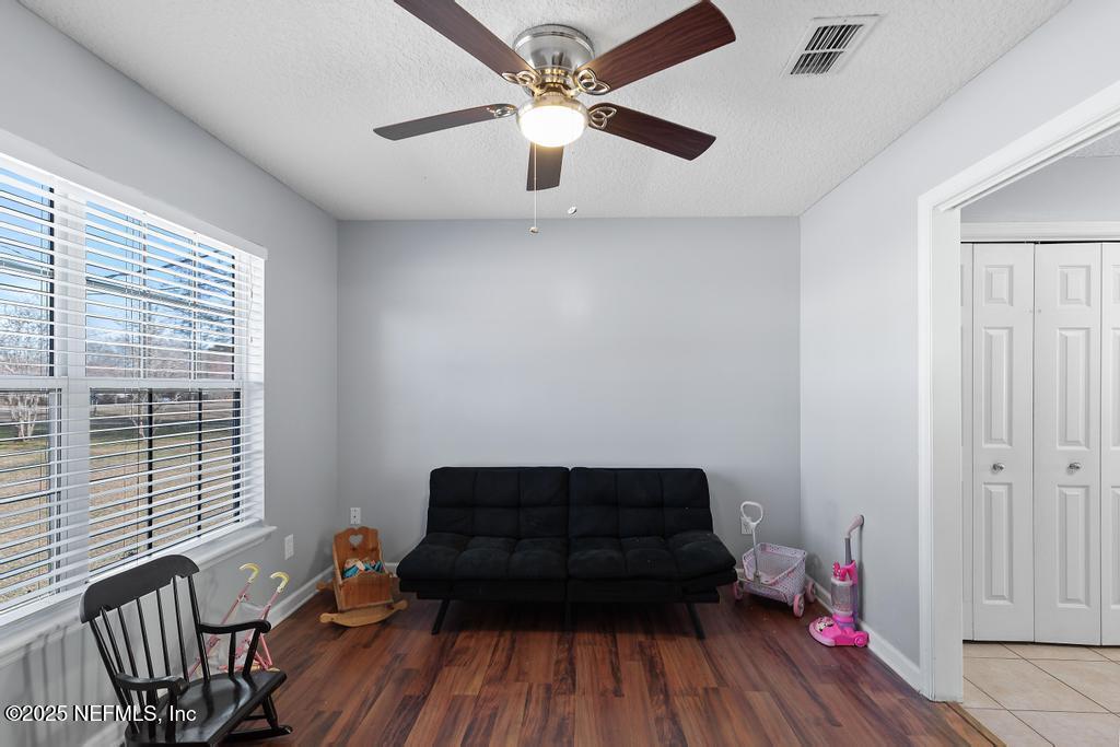 54170 Church Road Callahan, FL 32011 - Photo 16 of 44 a living room with furniture and wooden floor