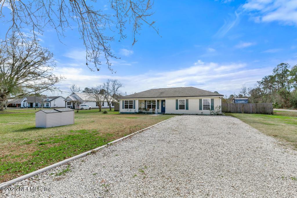 54170 Church Road Callahan, FL 32011 - Photo 2 of 44 a front view of a house with garden