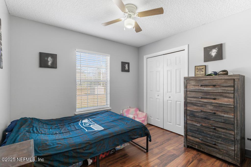54170 Church Road Callahan, FL 32011 - Photo 24 of 44 a room with furniture and wooden floor