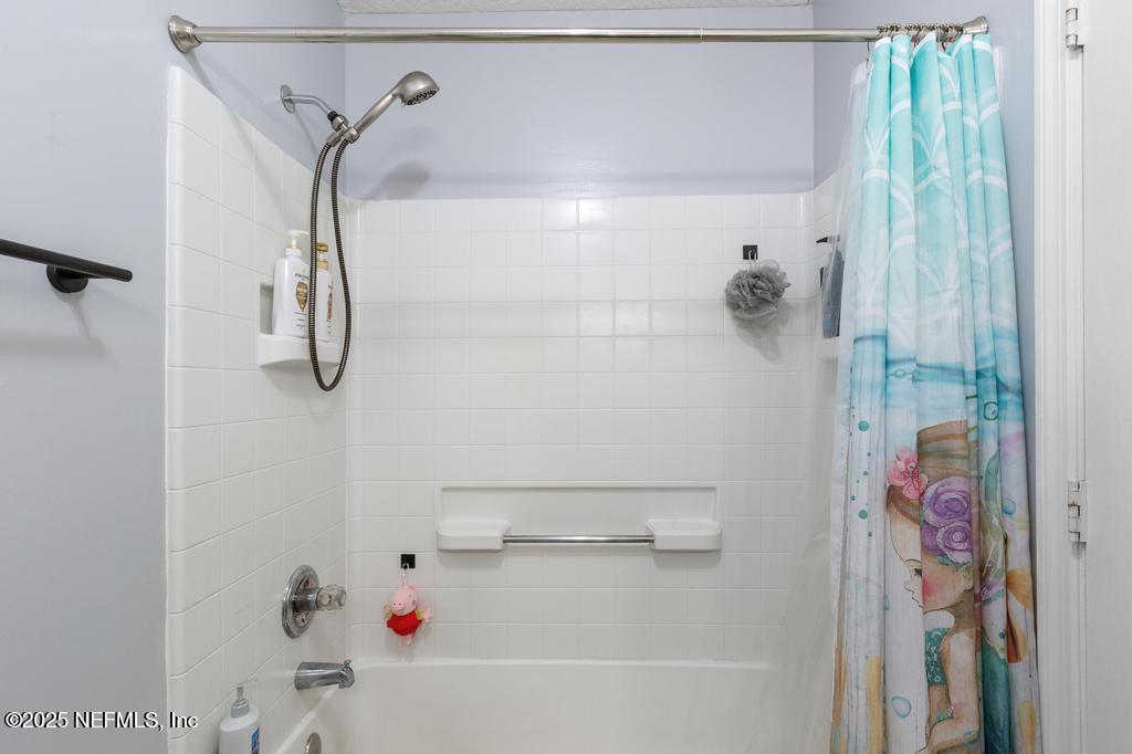 54170 Church Road Callahan, FL 32011 - Photo 26 of 44 a bathroom with a bathtub and shower