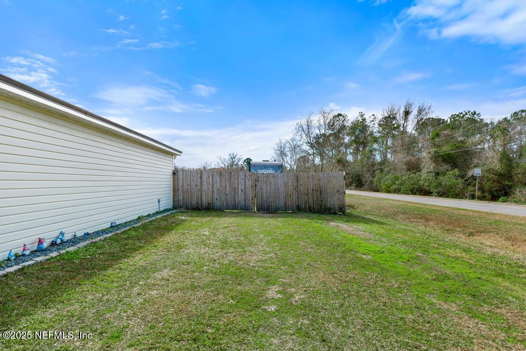 54170 Church Road Callahan, FL 32011 - Photo 3 of 44 a view of a backyard