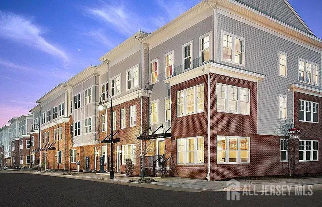 a view of a building next to a street