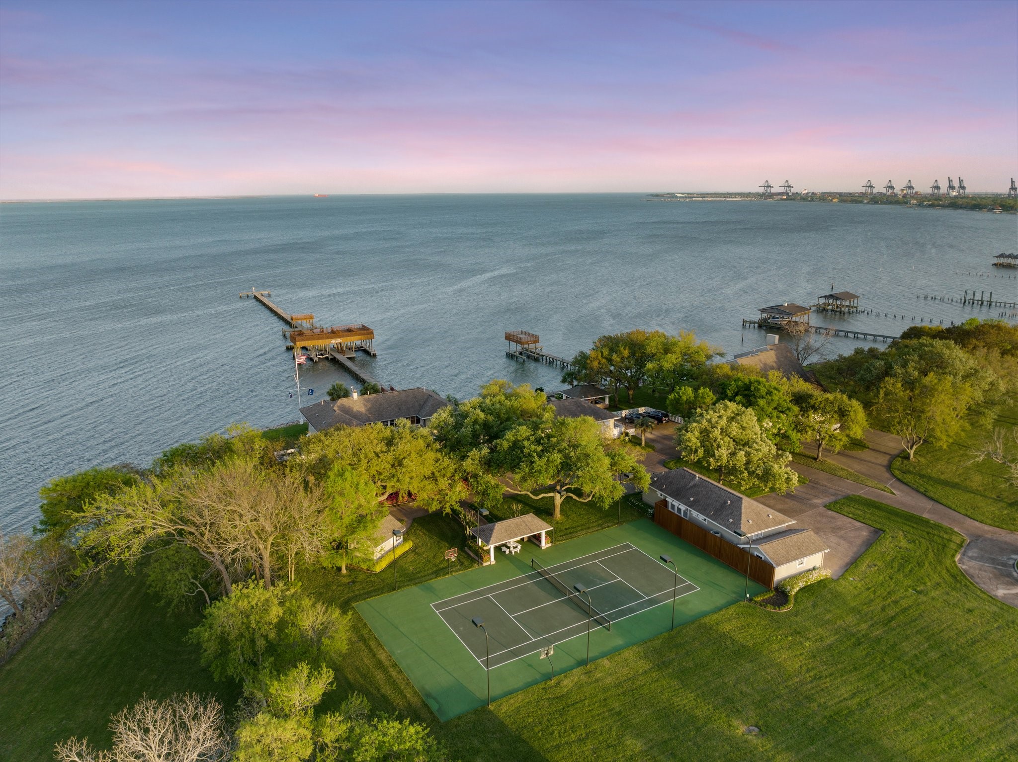 an aerial view of a house with a lake view