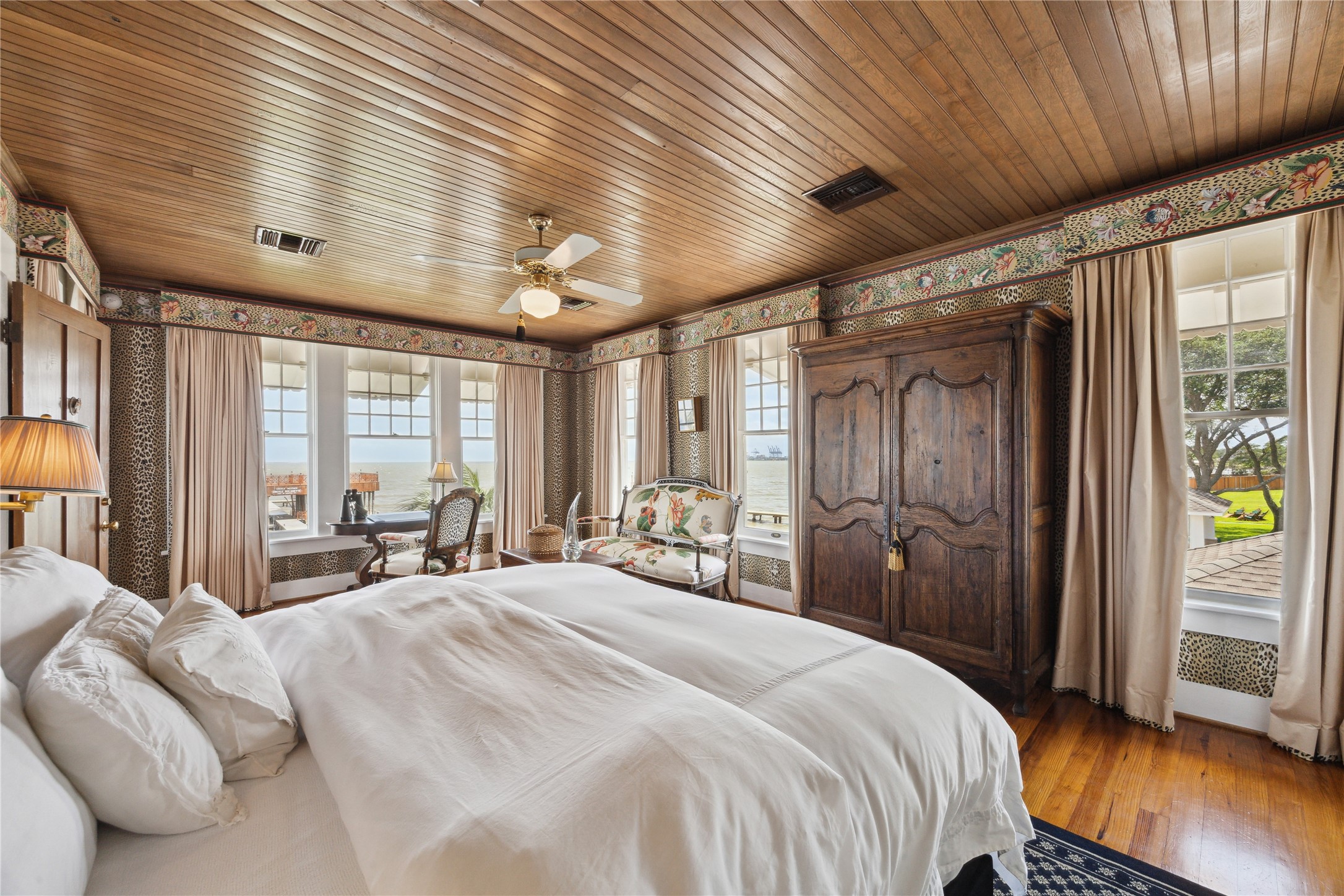 102 South R Street La Porte, TX 77571 - Photo 33 of 43 a bedroom with a bed and large windows