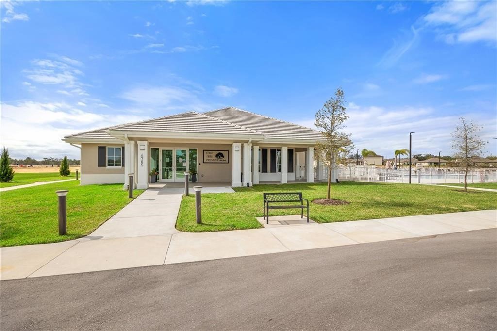 6710 Rumine Circle Vero Beach, FL 32967 - Photo 11 of 28 a view of house with a yard