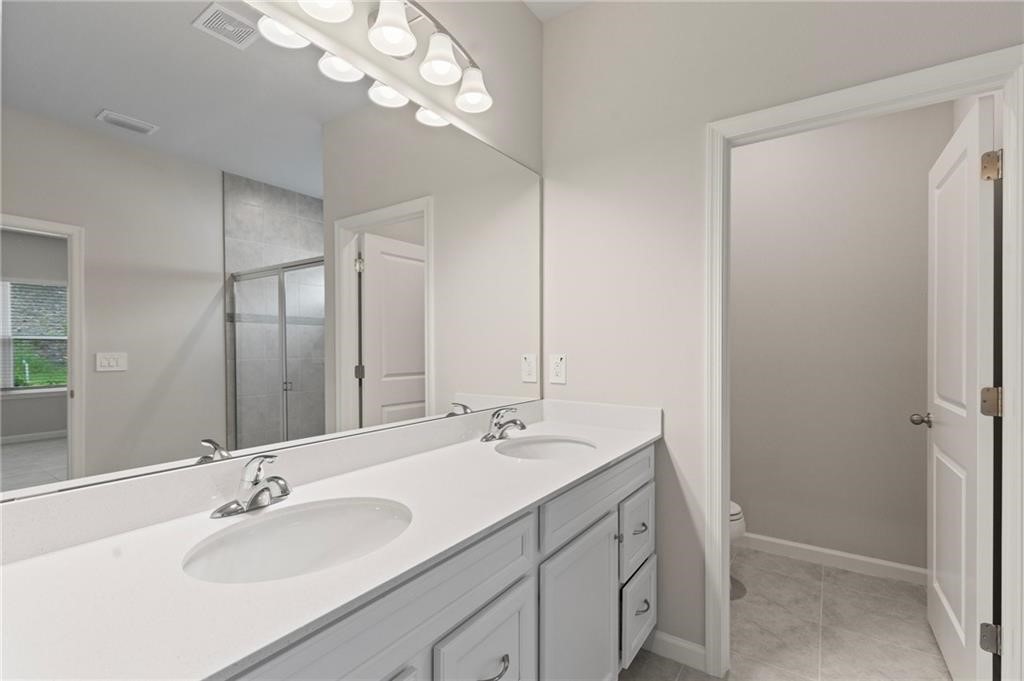 6710 Rumine Circle Vero Beach, FL 32967 - Photo 16 of 28 a bathroom with a sink a vanity and a mirror