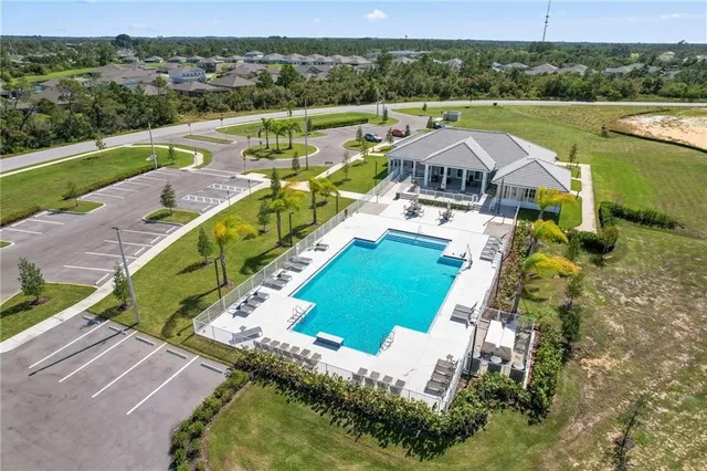 an aerial view of a house with a ocean view