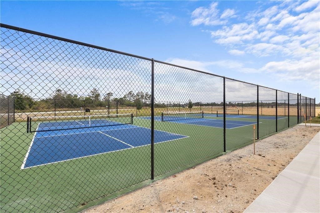 6710 Rumine Circle Vero Beach, FL 32967 - Photo 9 of 28 a view of a tennis court