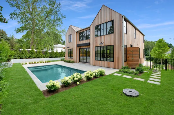 a view of an house with backyard space and garden