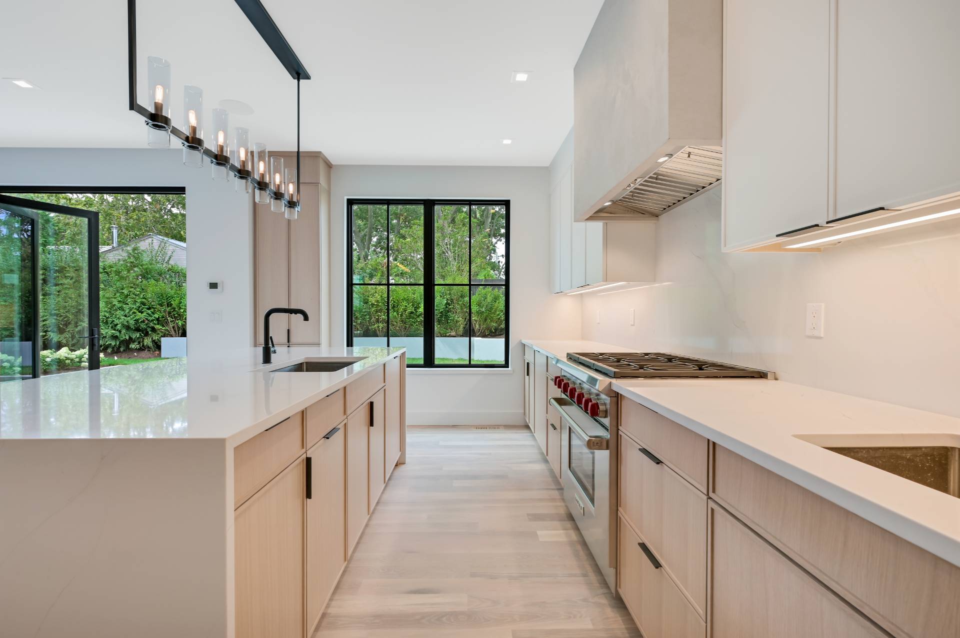 69 Ridge Drive Sag Harbor, NY 11963 - Photo 14 of 35 a kitchen with granite countertop a stove and a sink