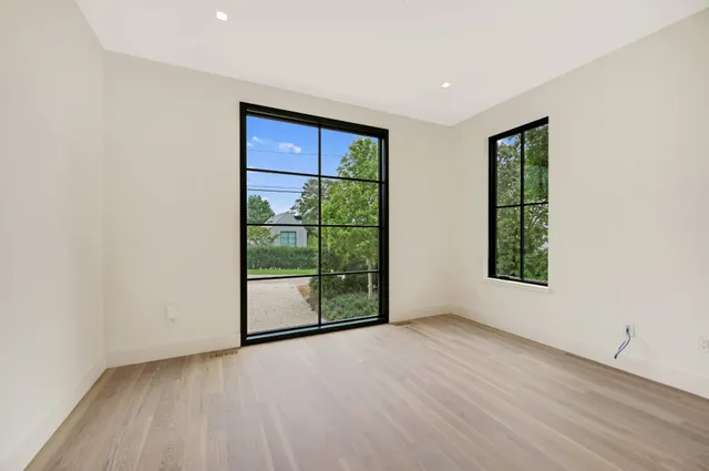 a bathroom with a toilet sink vanity and shower