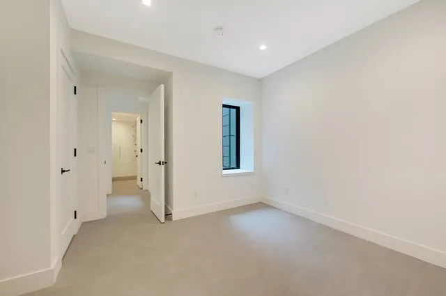 a bathroom with a toilet a sink a mirror and shower