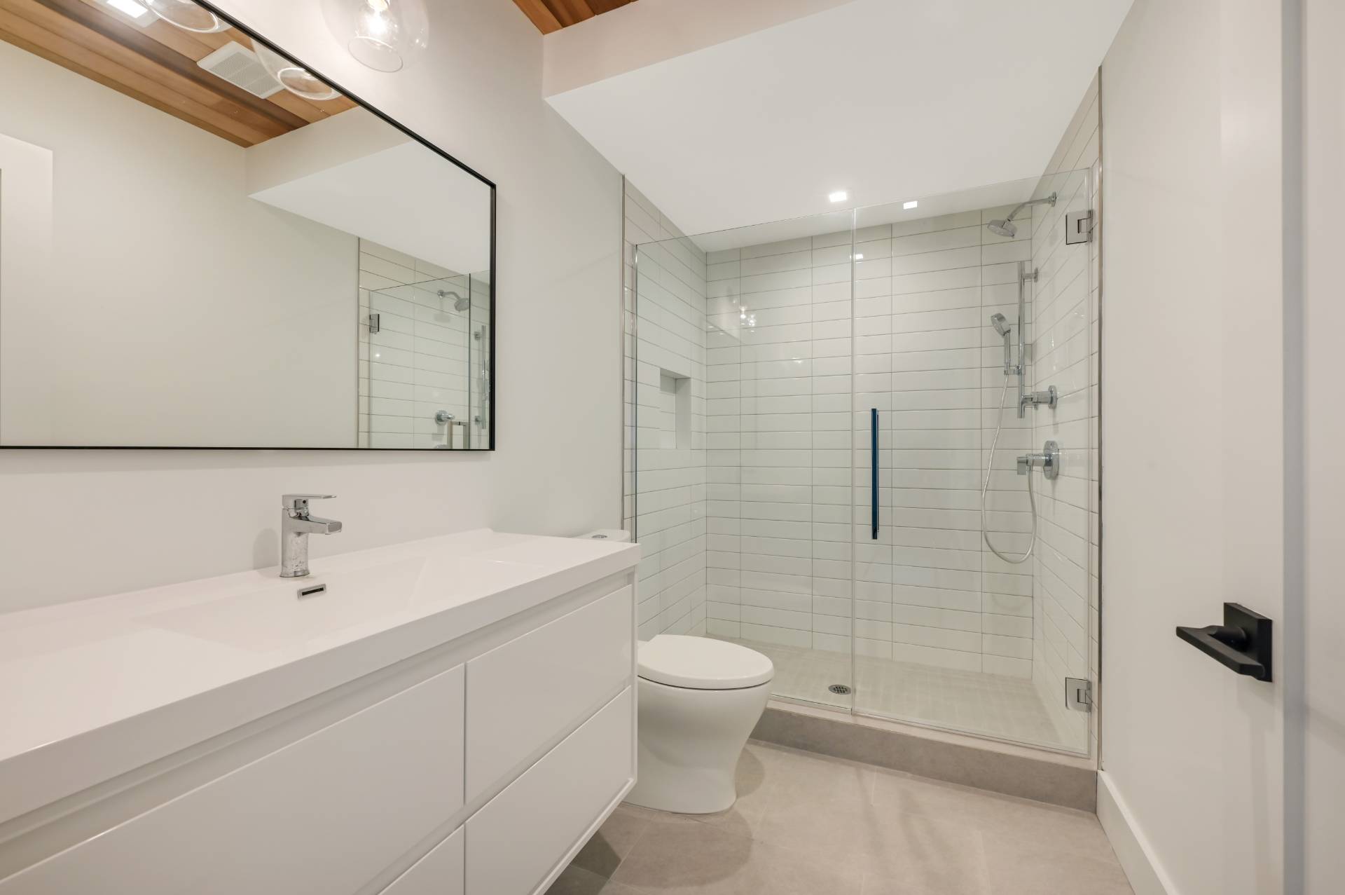 69 Ridge Drive Sag Harbor, NY 11963 - Photo 33 of 35 a bathroom with a toilet a sink a mirror and shower