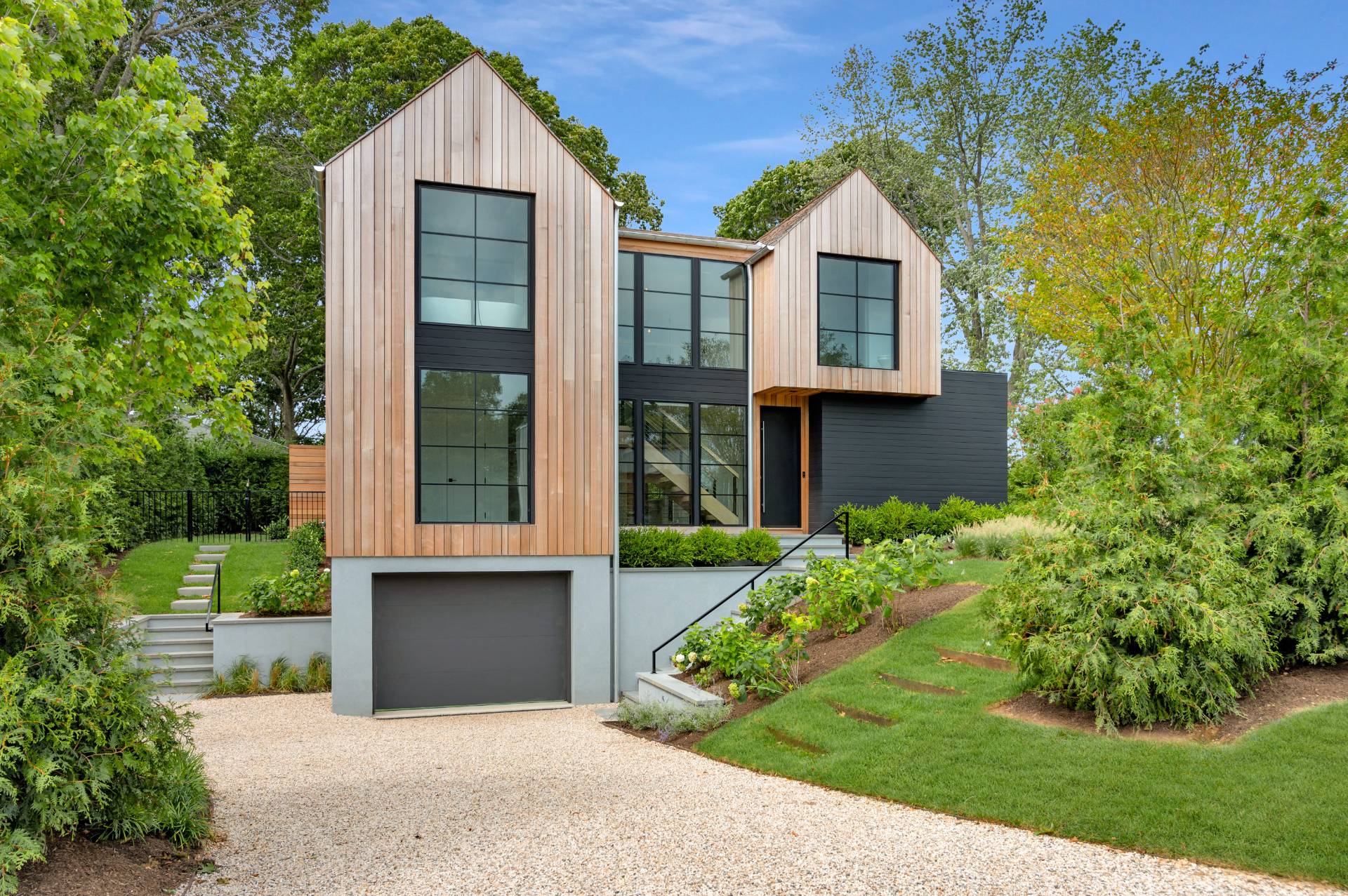 69 Ridge Drive Sag Harbor, NY 11963 - Photo 4 of 35 front view of a house with a yard and an trees