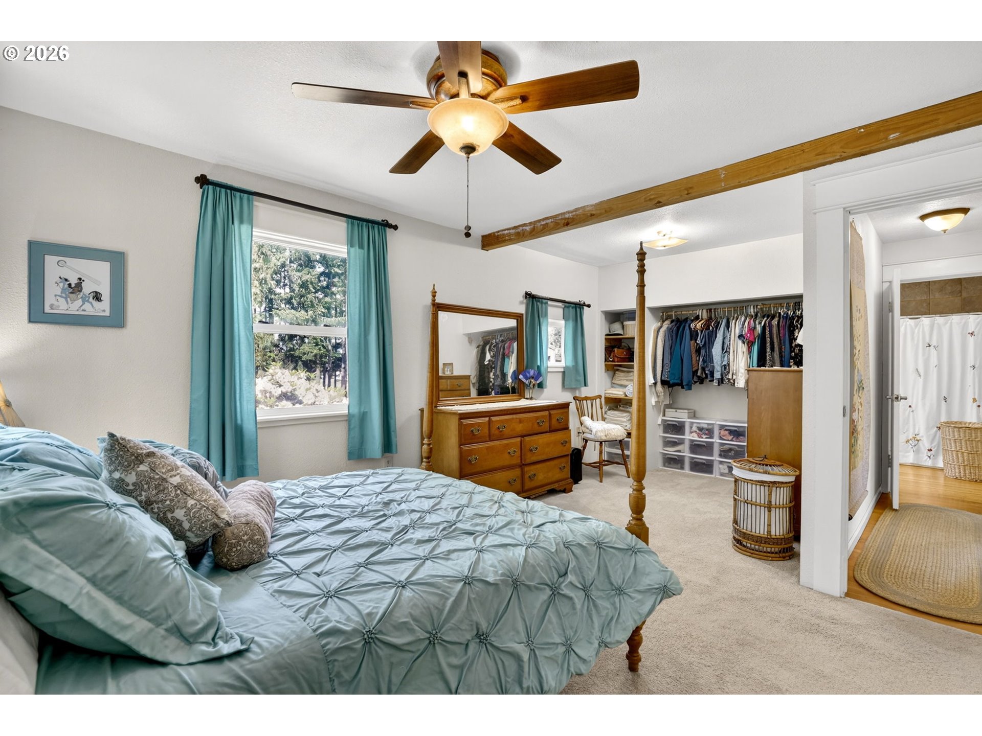 33951 Southeast Coupland Road Estacada, OR 97023 - Photo 13 of 48 a bedroom with a bed and a chandelier