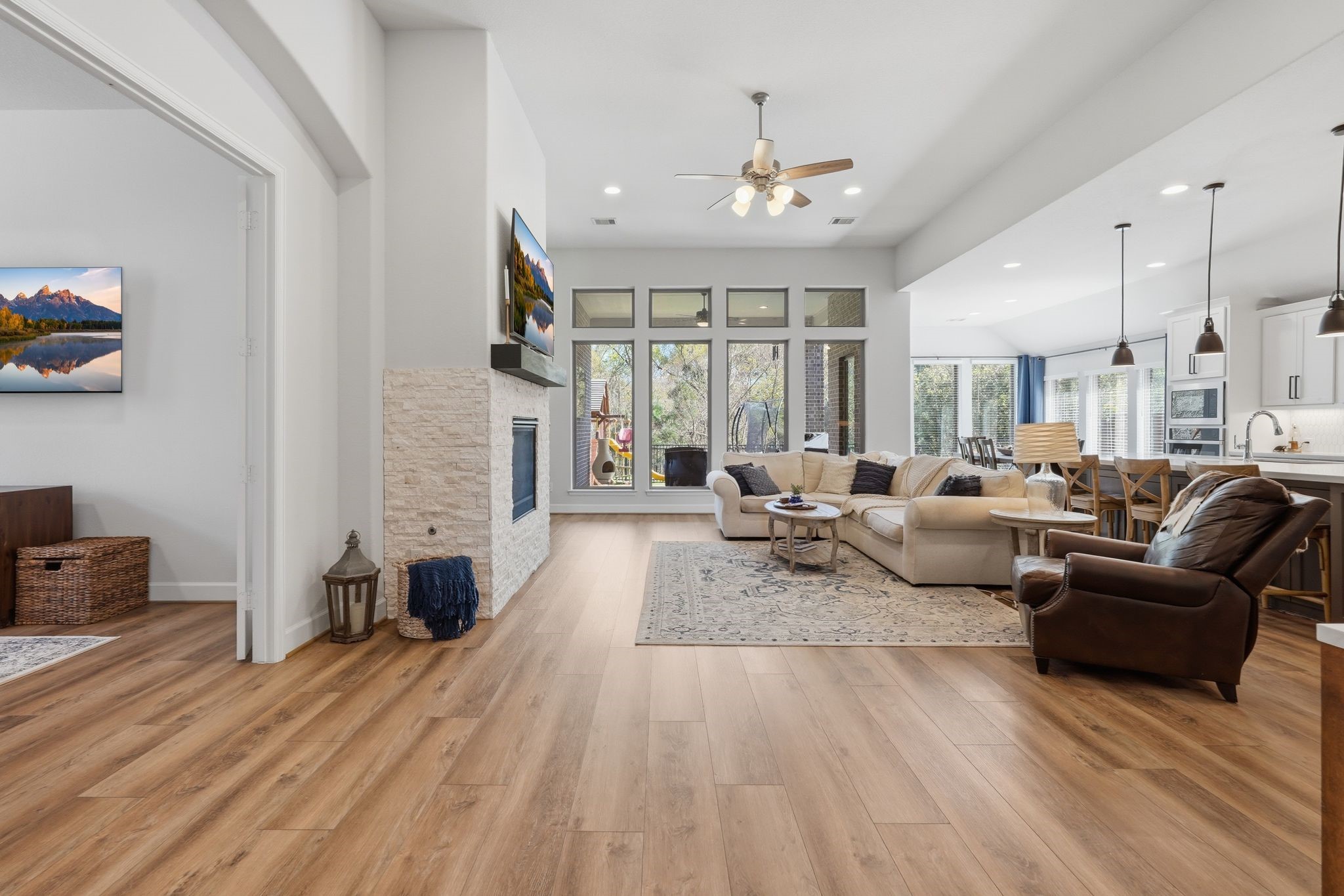 8602 Burdekin Road Magnolia, TX 77354 - Photo 11 of 50 Open concept w/ Gaslog Fireplace and views of the private backyard