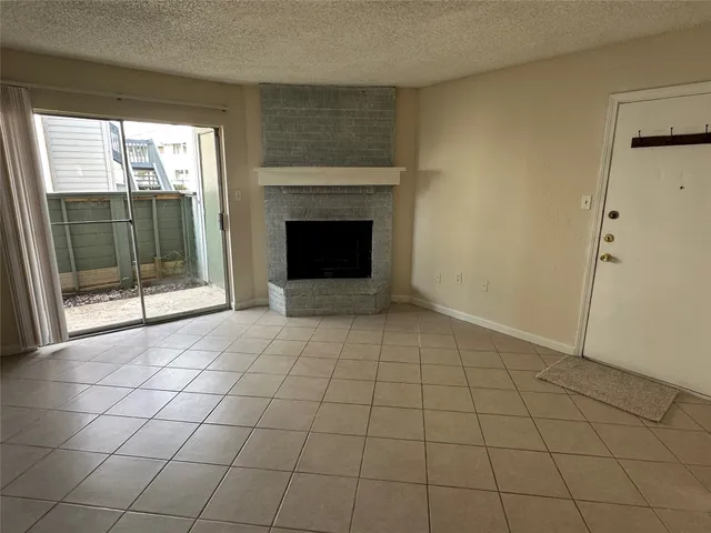 a view of an empty room with glass door