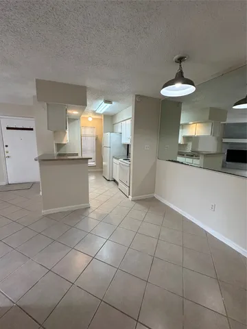 a kitchen with stainless steel appliances a sink and a stove