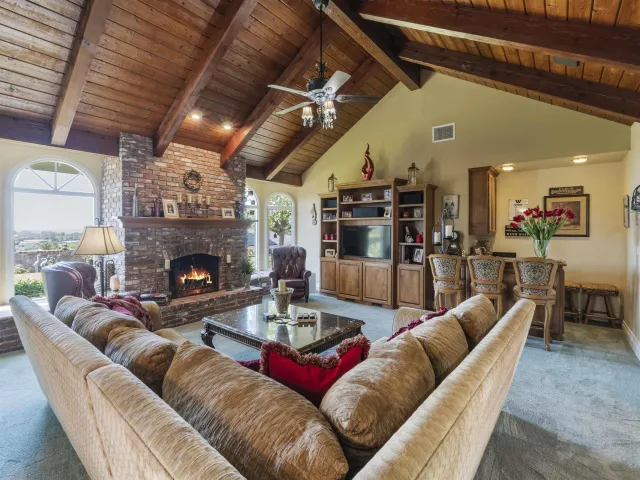 a kitchen with granite countertop a sink cabinets and wooden floor