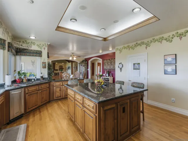 a kitchen with a sink and a large window