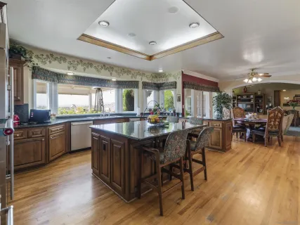 a bed room with a bed and a large window