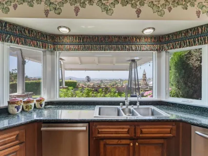 a bed room with a bed and a ceiling fan