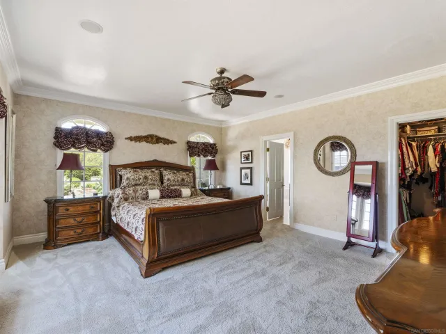 a spacious bathroom with a granite countertop sink mirror and shower