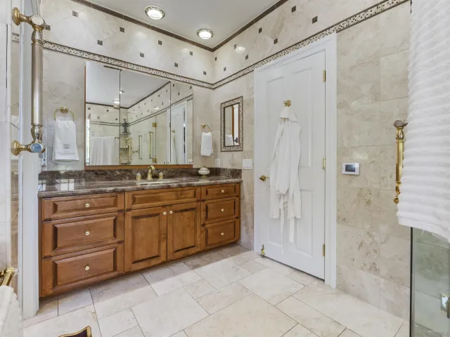 a workspace with lots of furniture and a large window