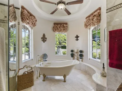 a bathroom with a granite countertop sink mirror and vanity
