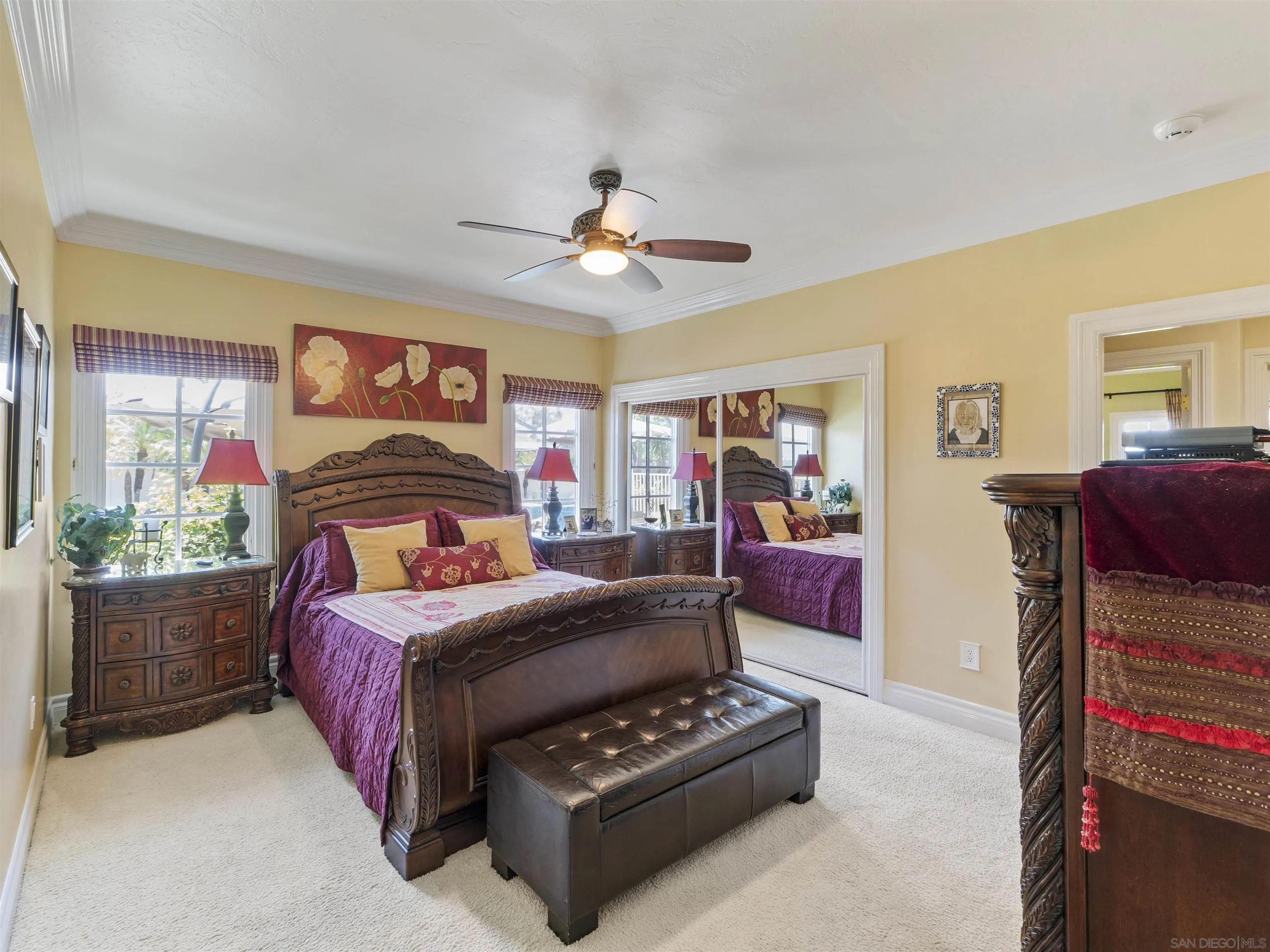17502 Corte Lomas Verdes Poway, CA 92064 - Photo 28 of 69 a bedroom with a bed and a chandelier
