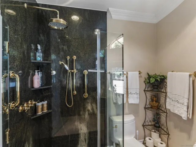 a view of staircase with lots of frames on wall