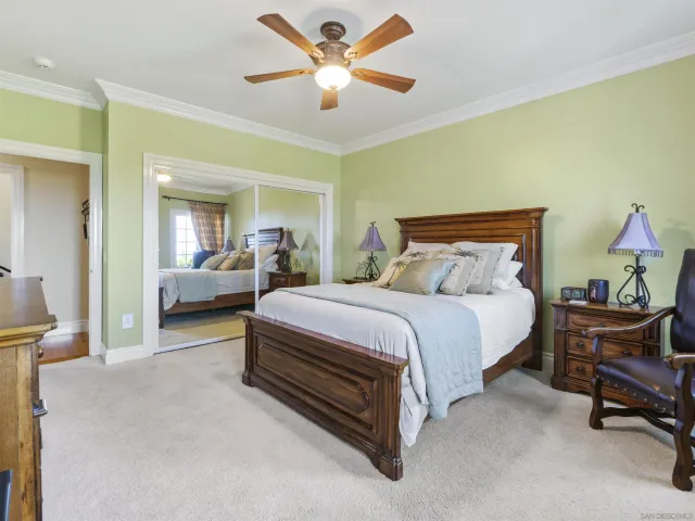 a view of a house with swimming pool and sitting area