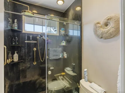 a view of a house with a yard and potted plants