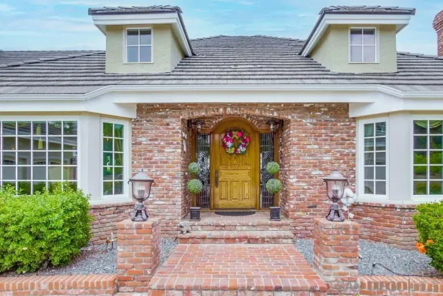 a living room with furniture fireplace and flat screen tv