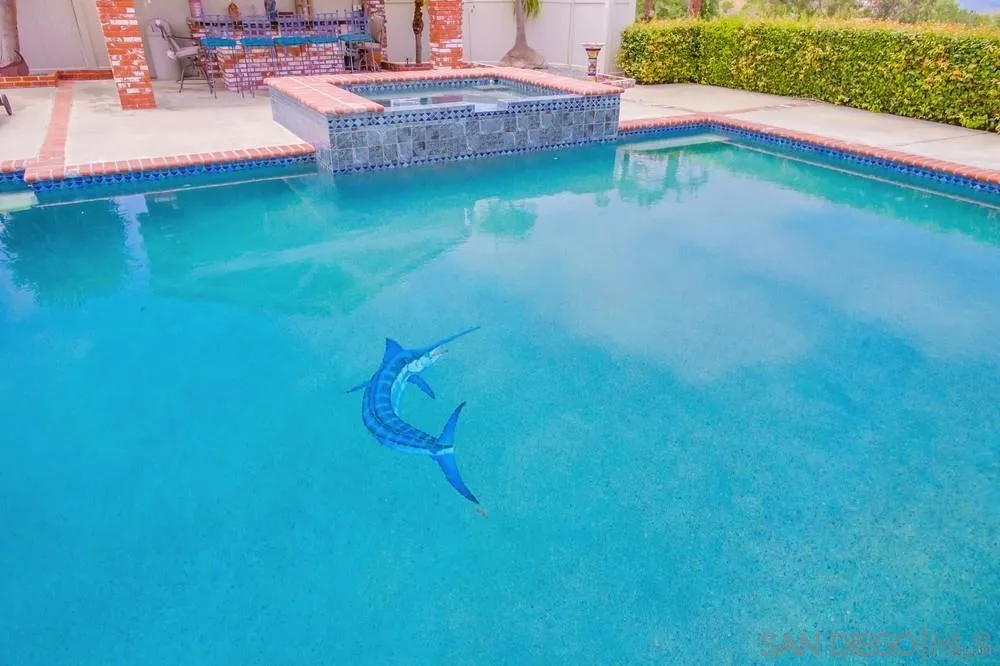 17502 Corte Lomas Verdes Poway, CA 92064 - Photo 50 of 69 a backyard of a house with table and chairs