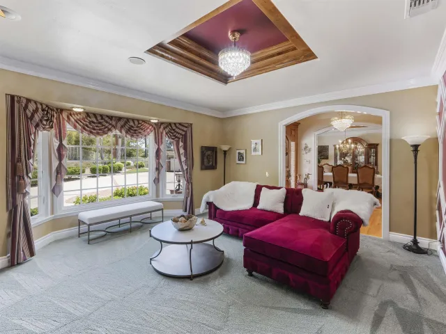 a view of a dining room with furniture and window