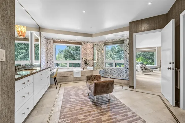 a large room with wooden floor and windows