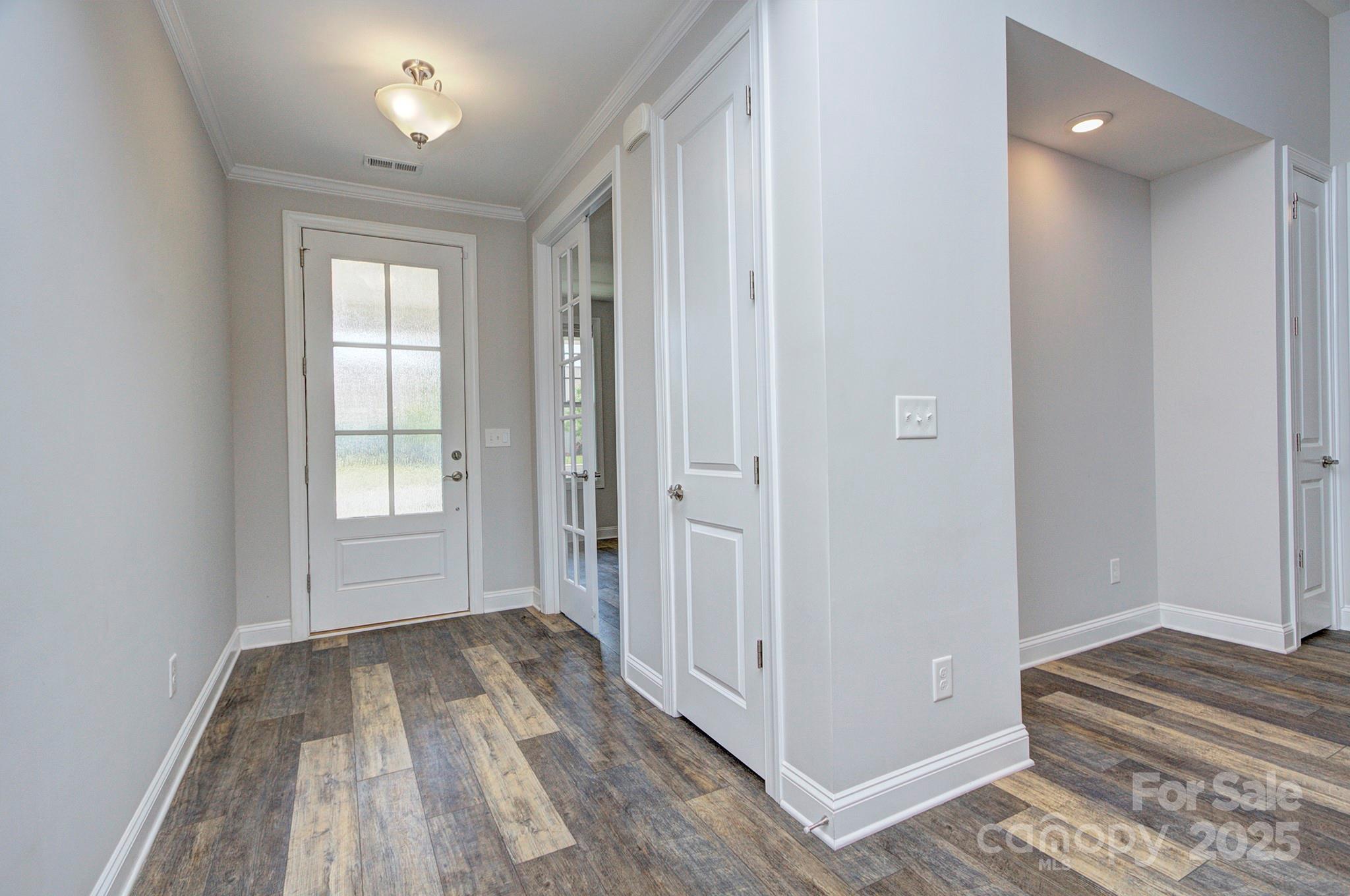 5527 Cheerful Lane Charlotte, NC 28215 - Photo 12 of 46 a view of a room with wooden floor and a bathroom
